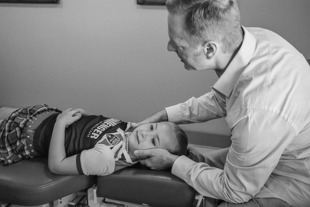 Dr. Kent Sifford adjusting a patient